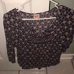 purple flowery blouse